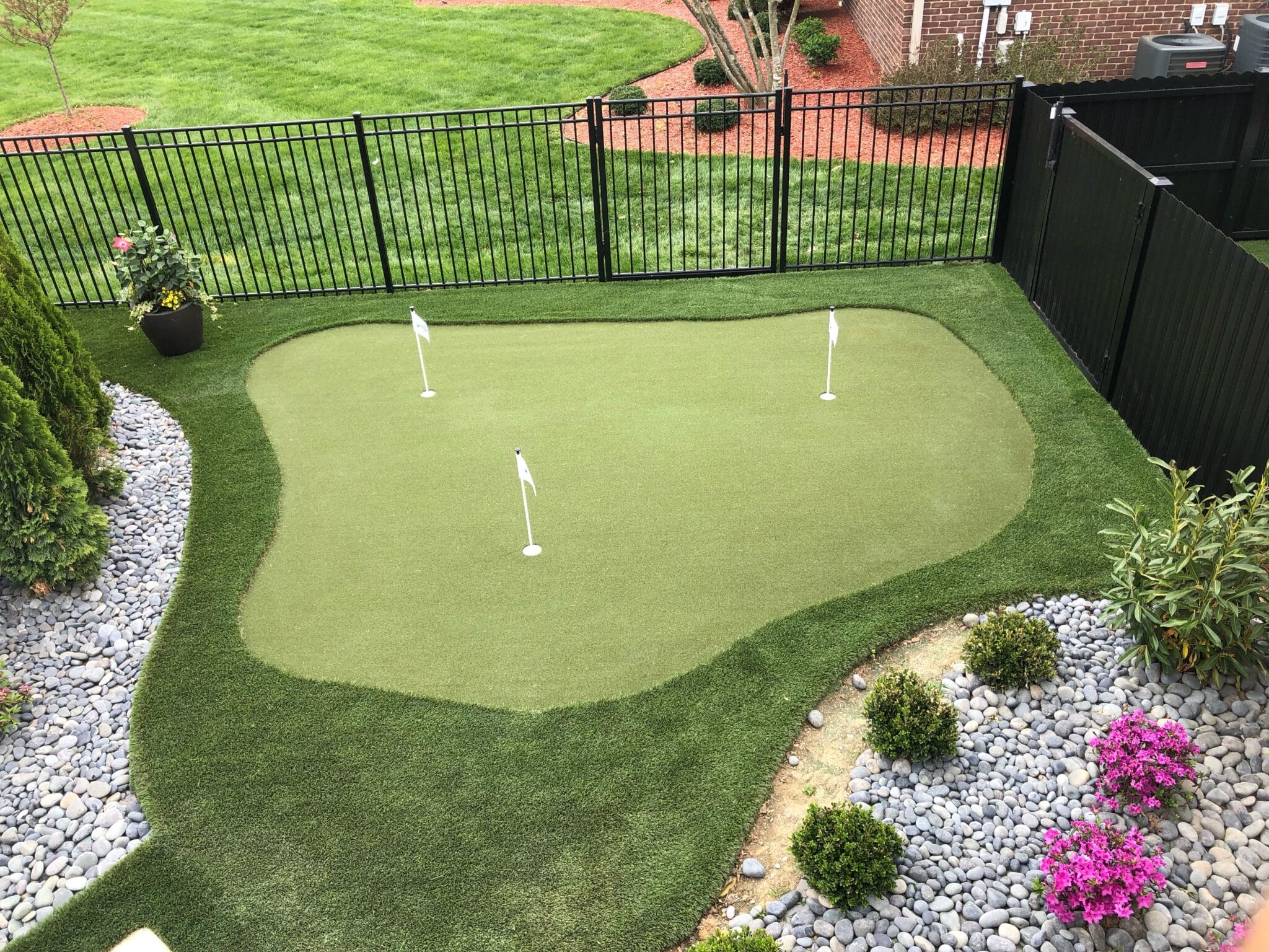 Backyard golf green installed by SYNLawn