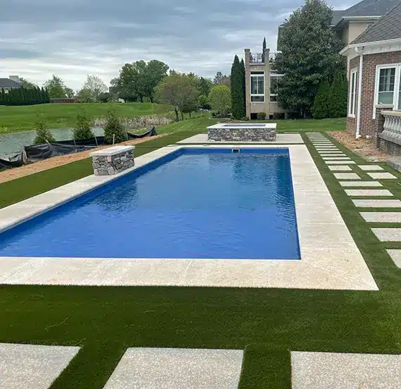 Backyard artificial grass pool deck in Louisville, KY